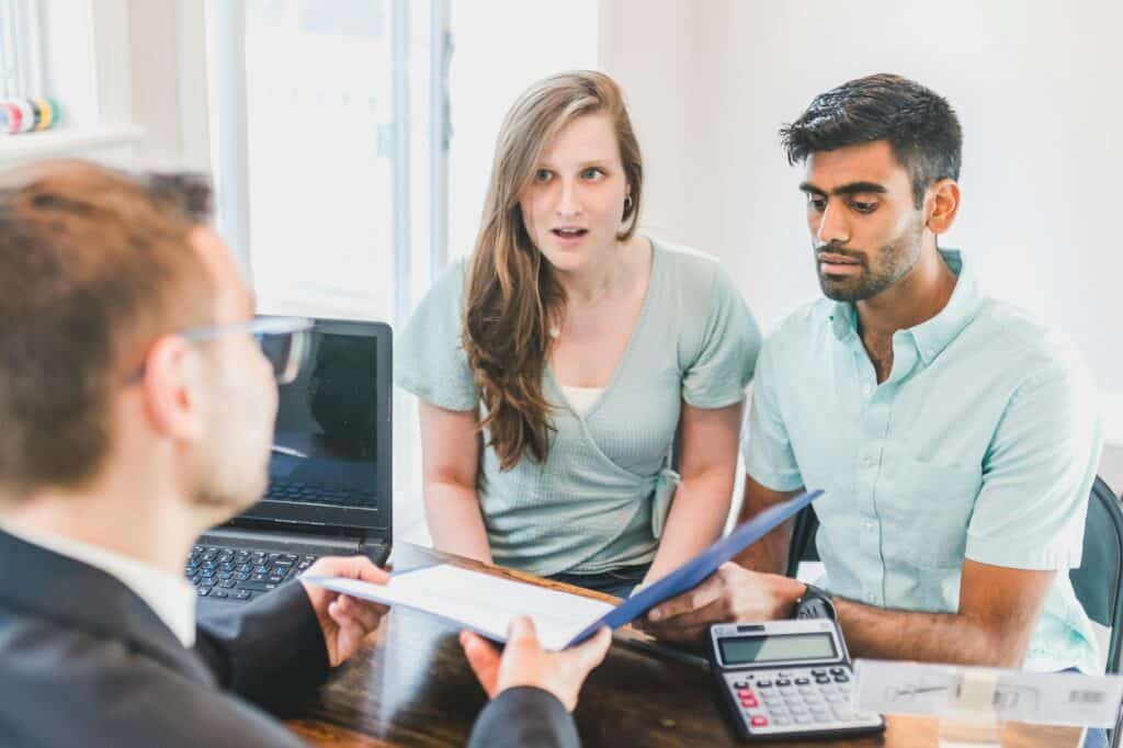 A couple is in a lawyer's office for legal advice