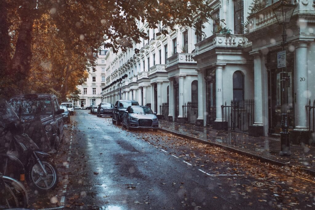 Cars parked outside residential buildings in the concept of affordable housing options in Wandsworth.